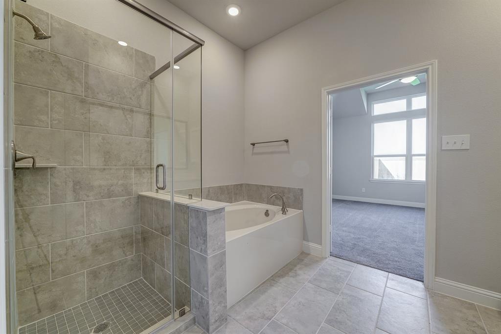 **Home is Under Construction. The photo shown here is of a completed home that has the same floor plan and similar elevation. Options and color selections may vary.**