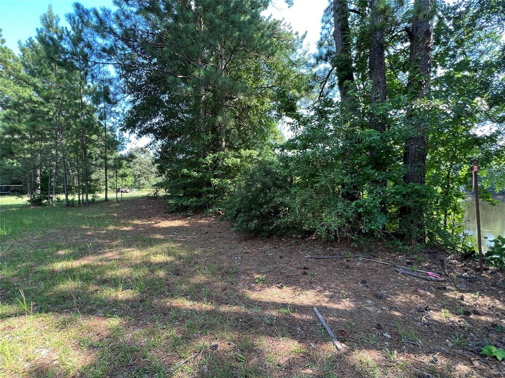 This Beautiful 2.11 acre property is connected to a small 5-6 acre lake that you can sit by and watch the beautiful sunset/sunrise with the peaceful sounds of the wildlife chirping in the distance.  You can build your own oasis out in the country. This property has lots to offer from the peaceful siren place to relax by the water, you can fish at the creek and the pond and you can build your forever home.  Must see this beautiful peace of property.