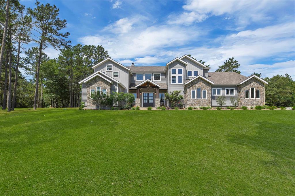 Beautiful custom home built in 2015 on 31 wooded acres. Trails designed for hiking; gun range & deer feeders are set for hunting season. Lake Livingston is only 8 miles away so putting your boat in the water is a breeze! The front yard has an aerated stocked pond with bass/crappie/bluegill and a firepit for evening bonfires! The back yard has a pool/spa, in-ground trampoline, basketball court, and playhouse. Gourmet Kitchen w/Thermador Range & Steam Oven, 5 bedrooms & 4.5 baths in the main house. Guest house for additioanl company with 1-2 bedrooms or perfect place for a home office. The climate controlled 3 car garage is a great place to set up him or her cave or workout room. The separate workshop has built-in benches ready for your tools! Behind the workshop there is parking for your boat, mower, and tractor. A newly installed whole-home generator gives your family peace of mind. This property offers a secluded, resort-like, tranquil setting, that will make you never want to leave!