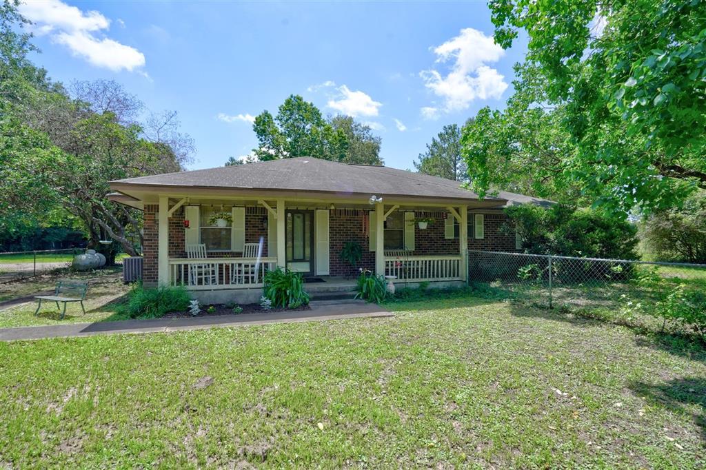 Beautiful property located on 7.04 Acres in the Heart of Splendora, Texas!  Perfect location visible from I-59 could be Residential or Commercial.  Enter long, private, tree-lined driveway to the main house located in the middle of the property.  The main house has 2,292 Sq.Ft, 3 or 4 Bedrooms, 3 Baths, huge living area, formal dining, country kitchen with lots of cabinets, wood burning fireplace, Front Porch that runs the length of the house and so much more!  Country living at its best! 392 Sq.Ft building used as farm hand quarters with 1 Bedroom, 1 Bath built in 1990.  Horse Barn, various sheds & chicken coop.  Large pond at the rear of property stocked with fish.  600 Sq.Ft. Carport. Several barns/storage buildings on the property.
178' of frontage on 1st Street visible from I-59 would make this a prime location for commercial business in the front part of property.  Great investment opportunity!  Do not miss out on this beautiful 7.04 Acre property!!