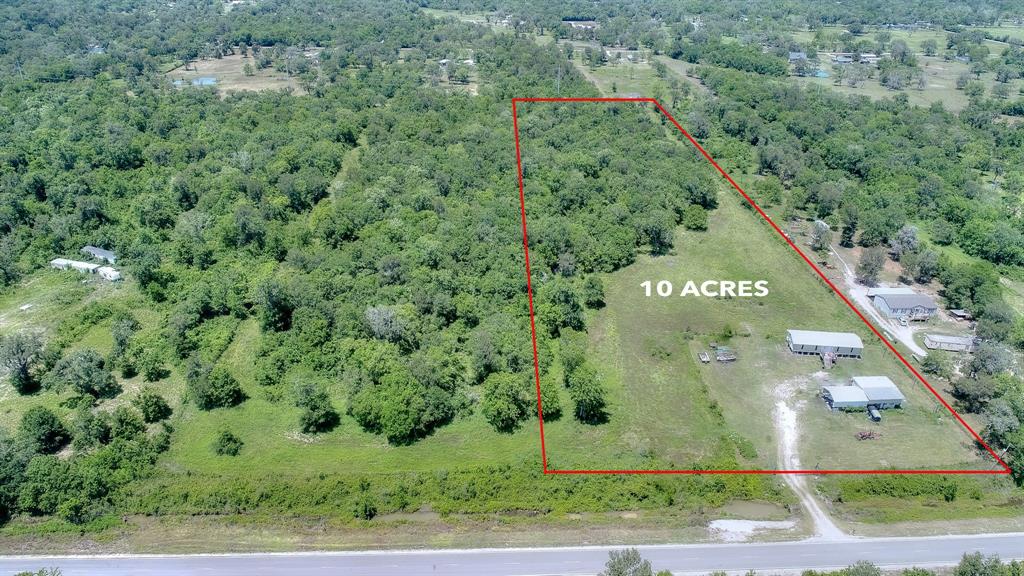 Partially Cleared 10 Acre Tract in Brazoria.  Easy access to Hwy 36. Includes 30'x30' Barn and extended Carport.  Approximately 5 Acres Cleared and Ready to Build.  Electricity, Well/Septic Tank are on the property.  High Elevation Land. No Restrictions, No HOA. Manufactured Home included, needs TLC. Listing is being sold “As is”.