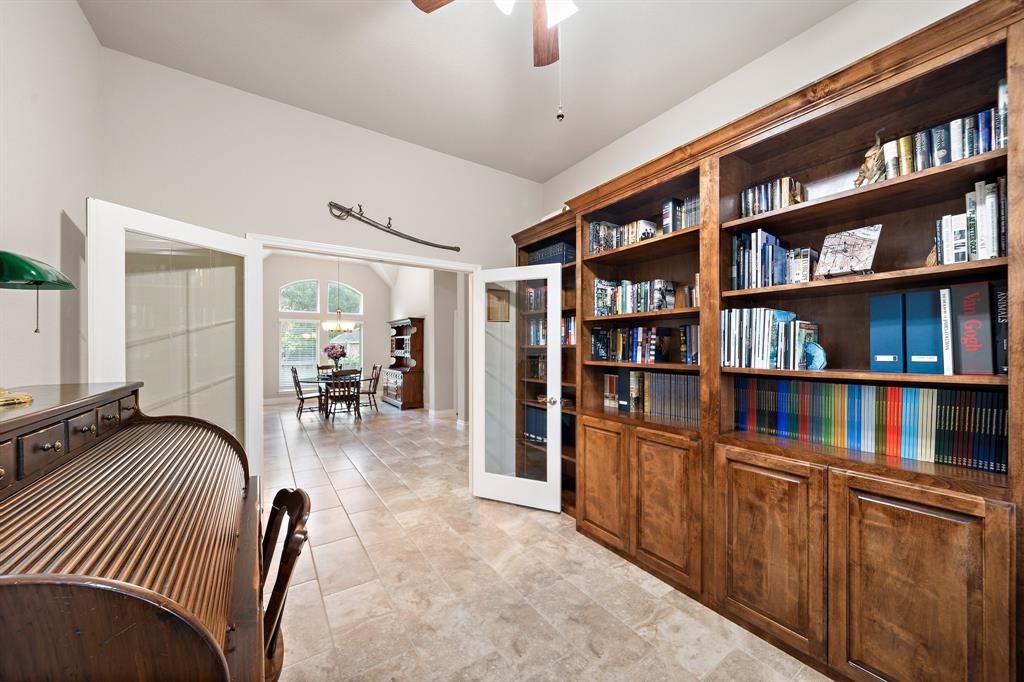 French doors open into the dedicated study area with space to easily accommodate extra seating and additional cabinetry. Conveniently accessible from the dining area and entryway, this flex room is easily convertible into a guest suite or media room.