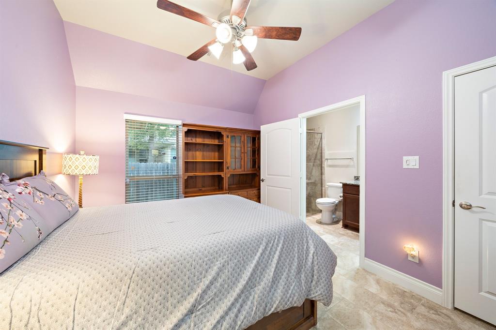 The secondary bedroom comes complete with a ceiling fan and its own ensuite bath for added convenience.