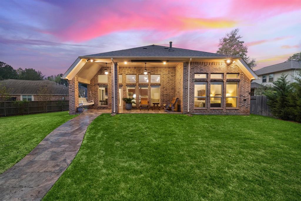 The covered brick patio comes complete with multiple lighting fixtures, plenty of seating, all the while providing seamless indoor-outdoor flow to the living and breakfast areas.