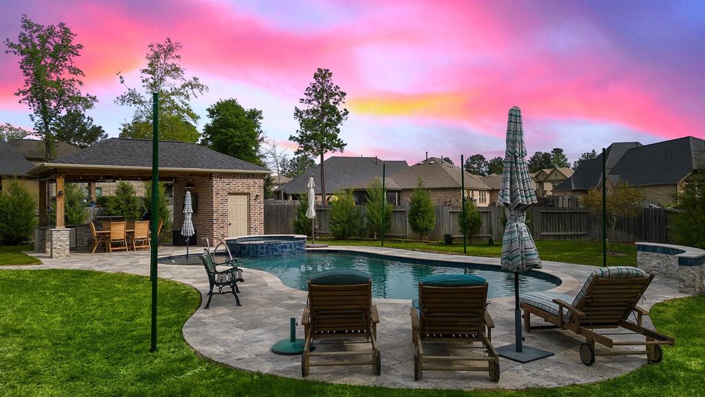 Take a refreshing dip in the relaxing pool complete with a spa, travertine surround, and multiple seating areas—all conveniently located by the cabana and summer kitchen. The pool comes complete with side poles fit for parasols and sunshades, built to provide shade on sunny Texan days!
