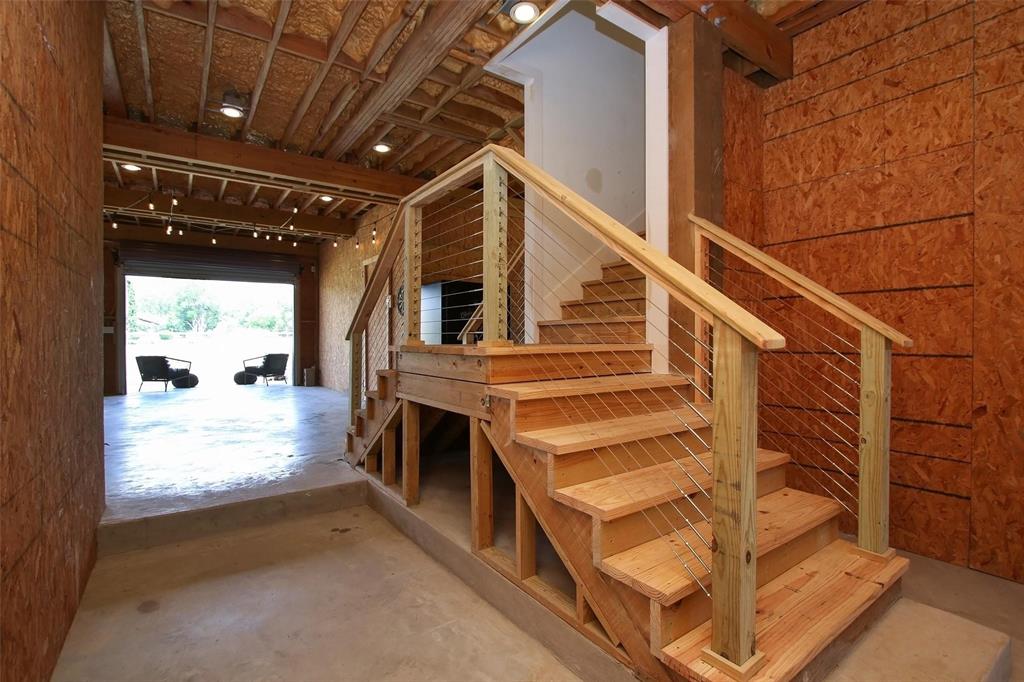 From entry on first level looking to the cable railing staircase that leads into the home