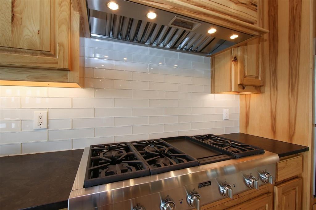 Thermador Professional 6 burner and griddle gas rangetop and commercial vent hood. 