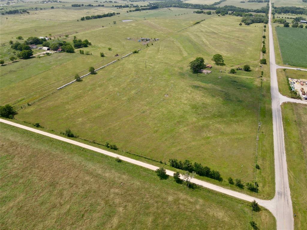 Rolling 11 acres in a highly sought after area of Lavaca County.  The property sits between the small communities of Praha and Komensky.  Multiple building sites sit atop the small knoll on the west side of the property. There is already a gated entrance that leads up to the existing water well and huge pecan trees that call this 11 acres home! Electricity is located nearby. Road frontage on FM 1295 and CR 1295B. Easy access to I-10, just a short 10 minute drive away. The property is ideally located 1 hour and 15 minutes from Houston, Austin, and San Antonio. Sale subject to Lavaca County subdivision approval.