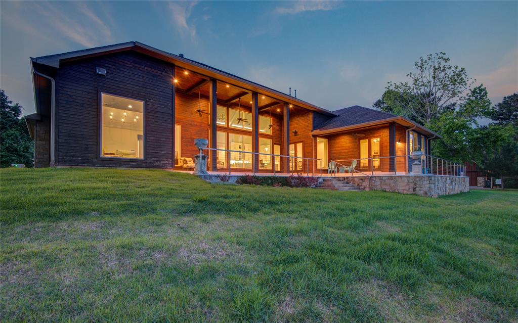 This home is surrounded  by irrigated manicured lawn