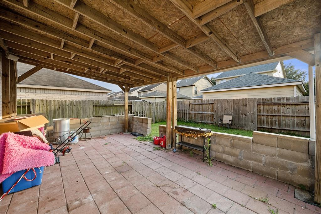 Backyard has a nice extended patio!