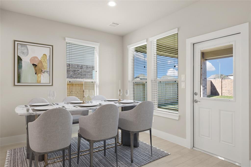 Start your day off right with a cup of coffee sitting with your family in the lovely breakfast area! Featuring large windows with blinds, custom neutral paint, tile flooring, recessed lighting and high ceilings.