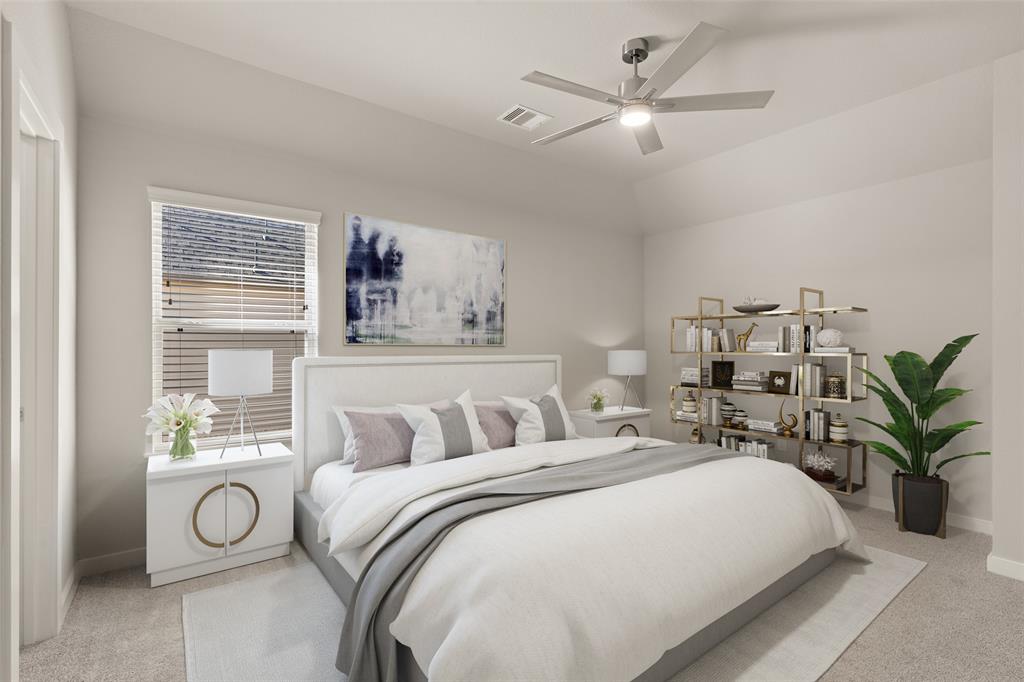 Secondary bedroom features plush carpet, custom paint, ceiling fan with lighting and a large window with privacy blinds.