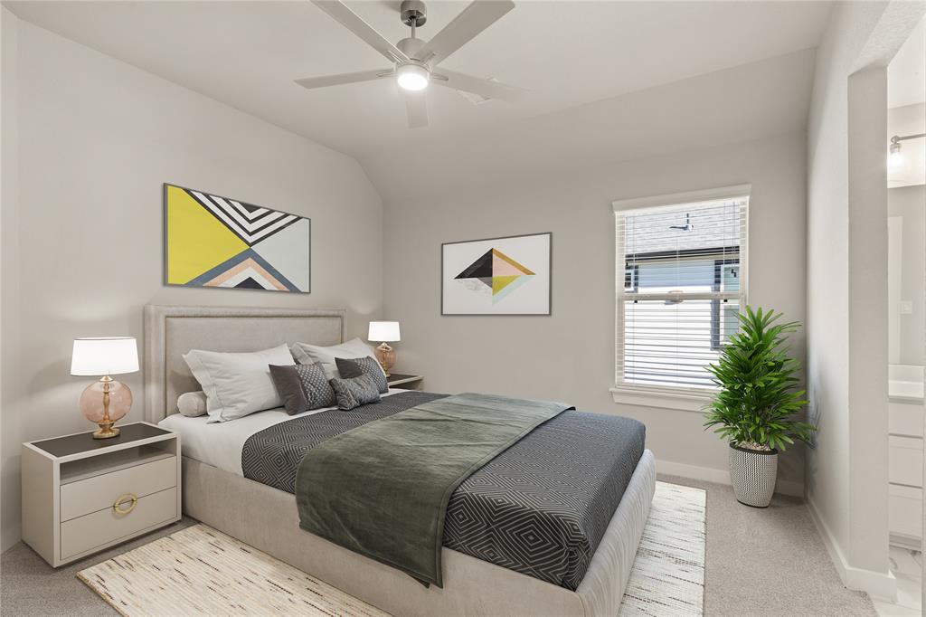 Secondary bedroom features plush carpet, custom paint, ceiling fan with lighting, large window with privacy blinds and access to the Jack and Jill bath.