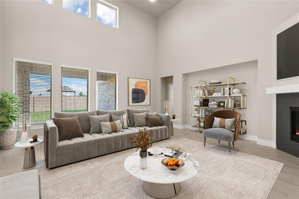 Gather the family and guests together in your lovely living room! Featuring high ceilings, recessed lighting, custom paint, gorgeous floors, fireplace with mantel and large windows that provide plenty of natural lighting throughout the day.