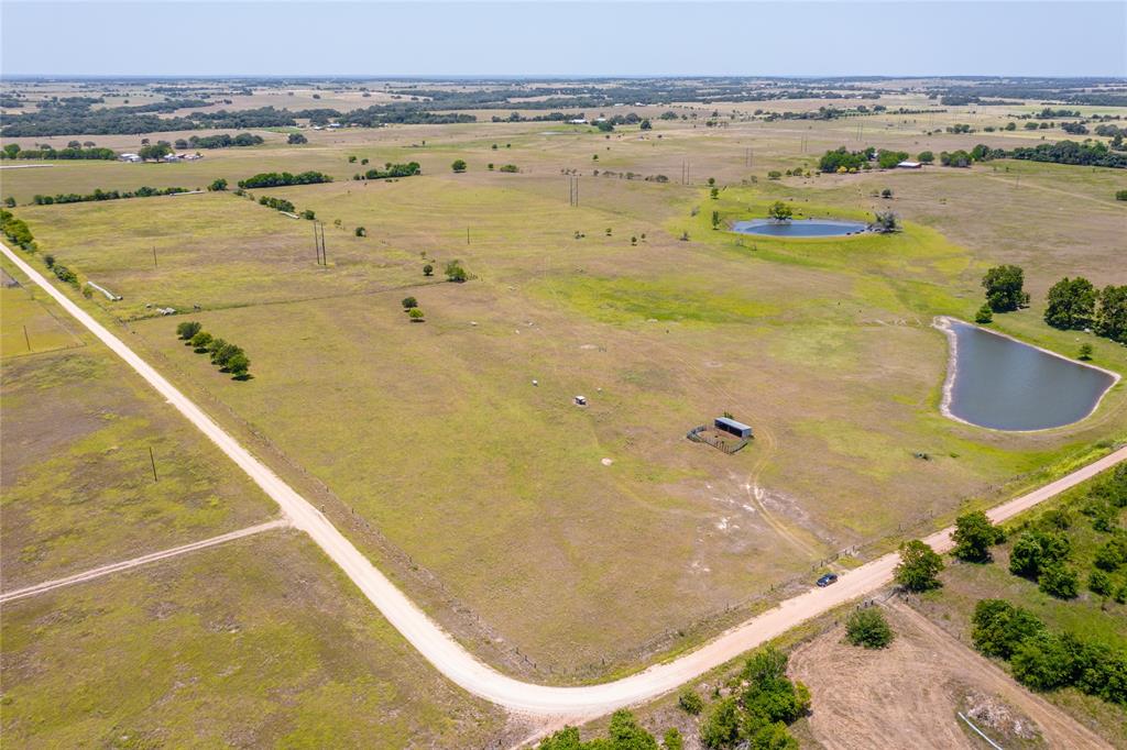 Stunning property located in Moulton, Texas. If you are looking for the perfect property with minimal maintenance this is it. With a little over 50 acres this property features, mature Pecan trees, rolling hills, a water well that is 262' deep that produces 11-12 gallons per minute and electricity is already on the property as well.  Spend your time enjoying a crystal clear 1.5 acre spring fed pond, stocked with hybrid bass and bluegill year round and when the temperature drops the ducks will make the pond their home. This incredible property also has 12.5 acres fenced off and improved with coastal hay. Come build your dream home where every sunset will take your breath away.