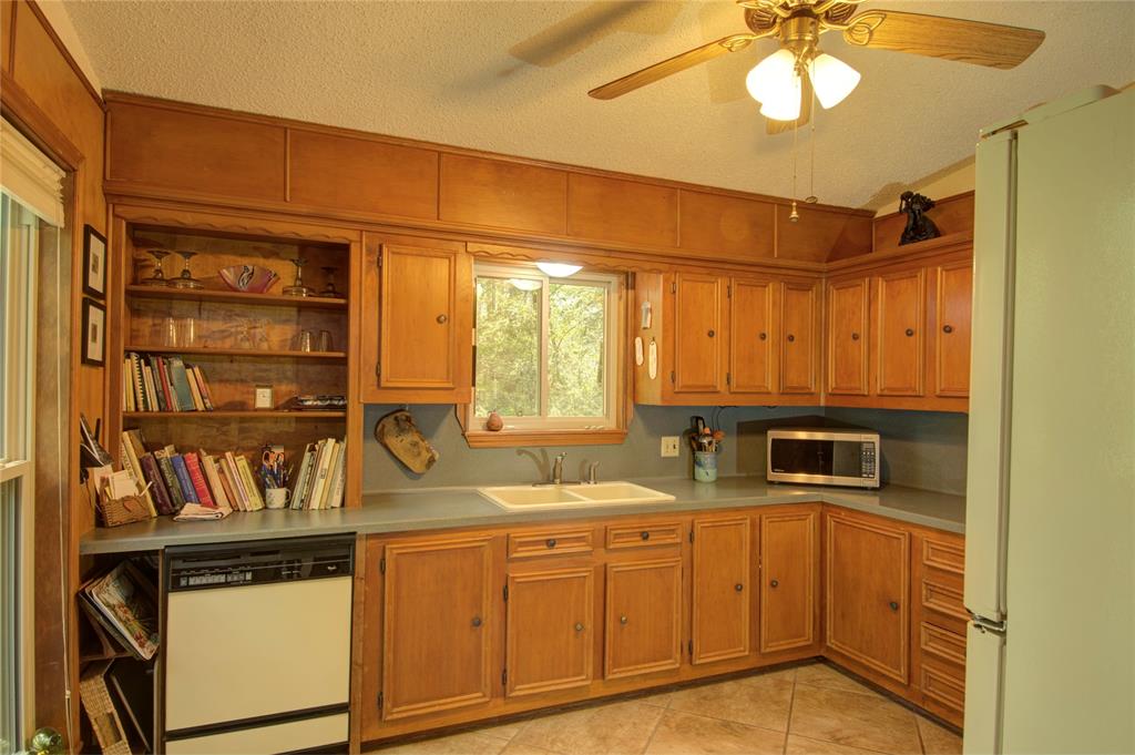 This kitchen has a great view of the front and side yards.