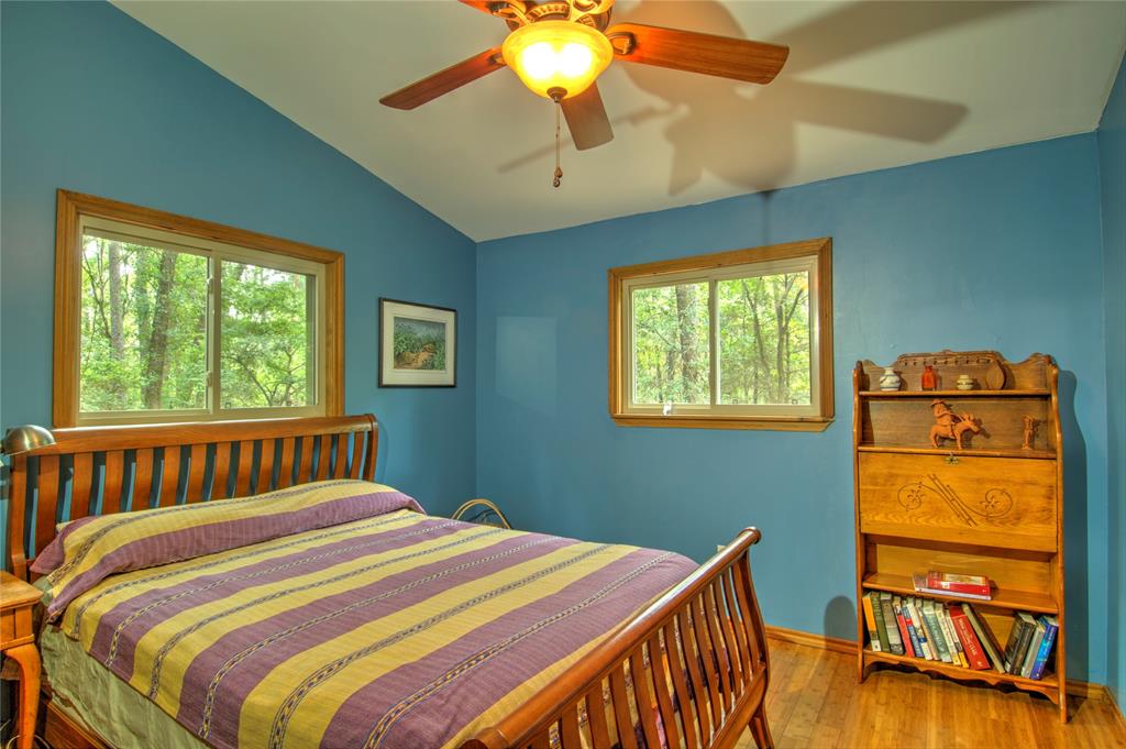 The secondary bedroom has views to the side and back yards, and features bamboo flooring.