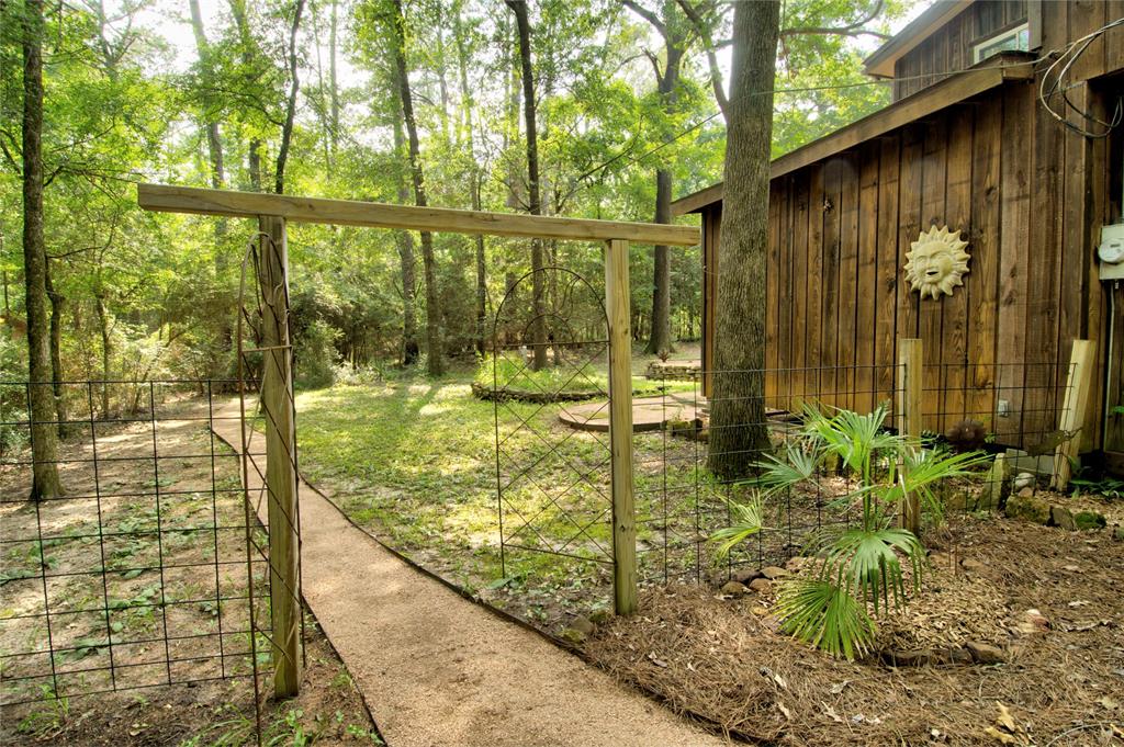 The entrance to the backyard, featuring crushed granite walkways.