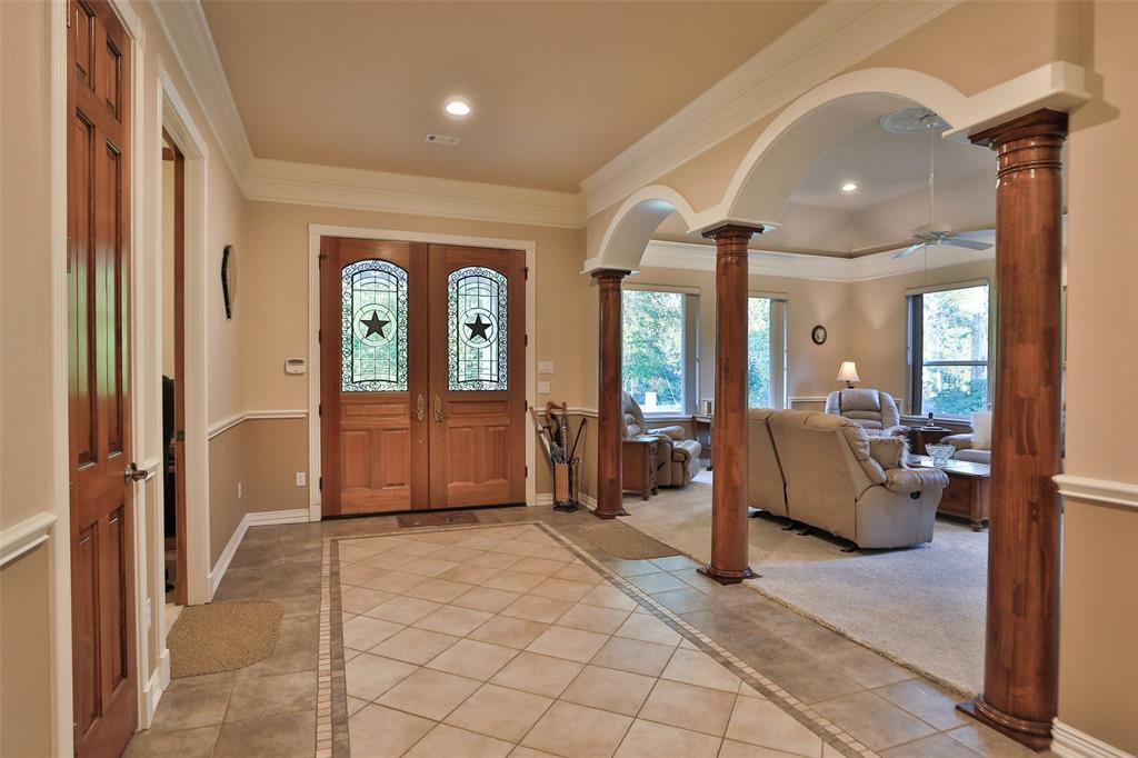 A view looking back at the front doors. The double doors include decorative windows with stars in the center.