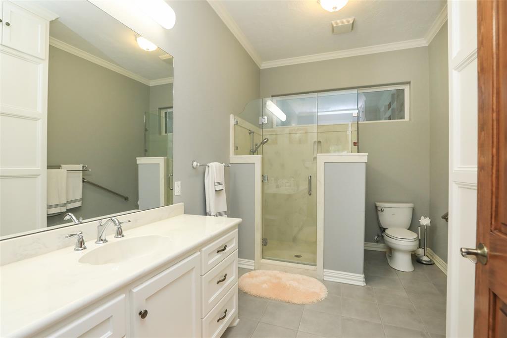 This bathroom is designed for physically older/impaired users. Step/wheel in shower with bench seat, grab bar, and extra long shower hose.  All light switches installed at handicapped level (easy from a wheelchair).