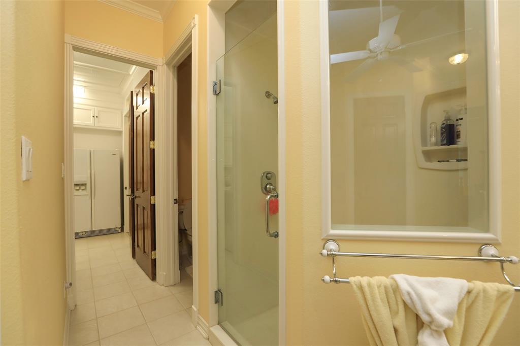 The primary bathroom conveniently leads into the utility room for easy access in taking your clothes to the laundry.