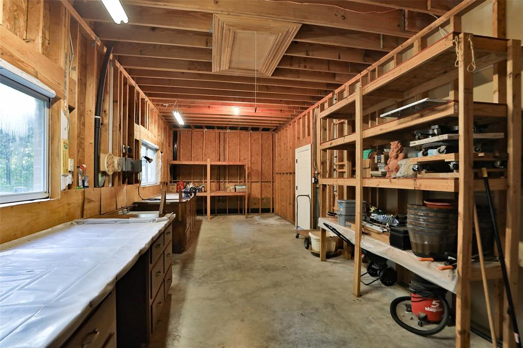 Another view of the workshop. The door leads to the 3 car garage.