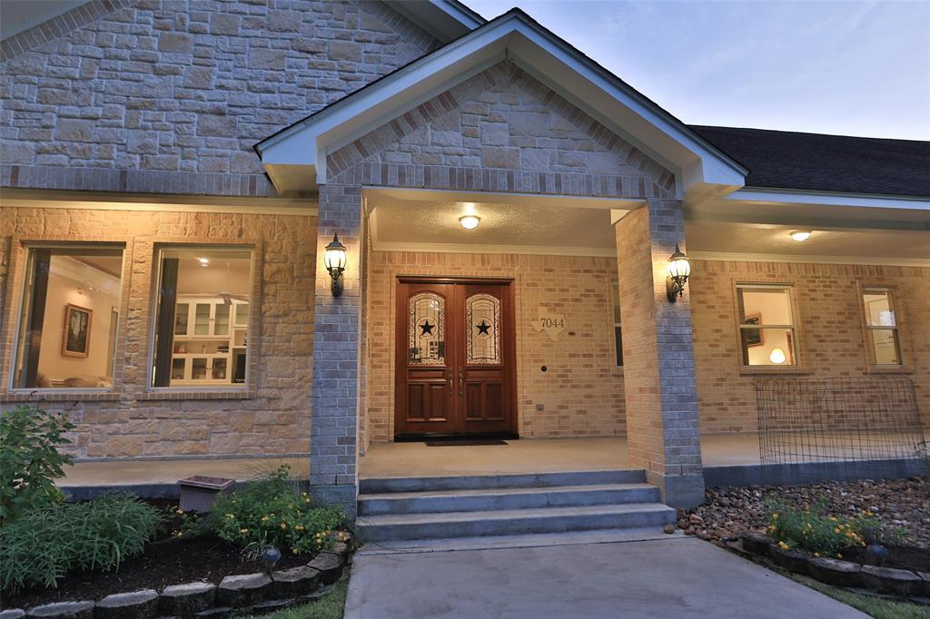 Step up to this gorgeous porch. Plenty of room for your outdoor furniture!