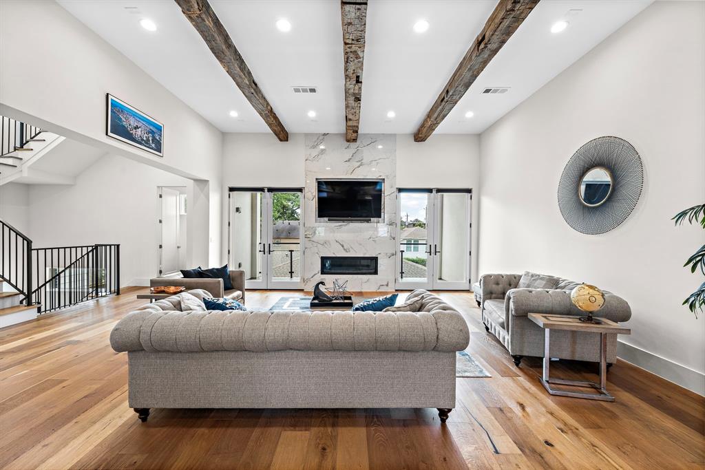 2nd floor great room with balcony and outdoor kitchen conveniently located for grilling.