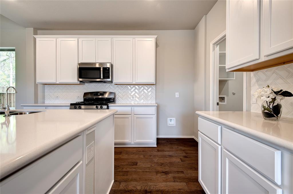 Won't have a problem with kitchen storage with walk in pantry, lots of cabinets.  Perfect for entertaining large or small groups.