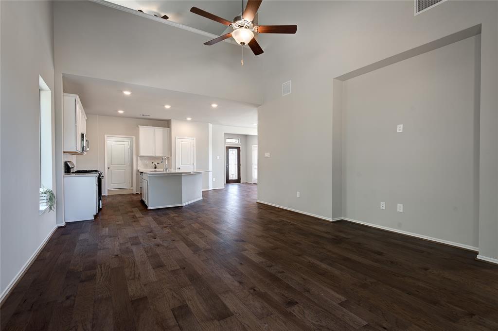 Family room with gorgeous wood floors, easy to maintain, too.
