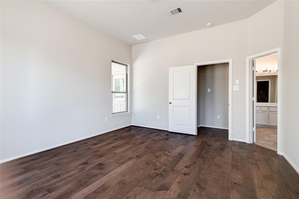 Master bedroom with double doors to bath. Notice large walk-in closet.