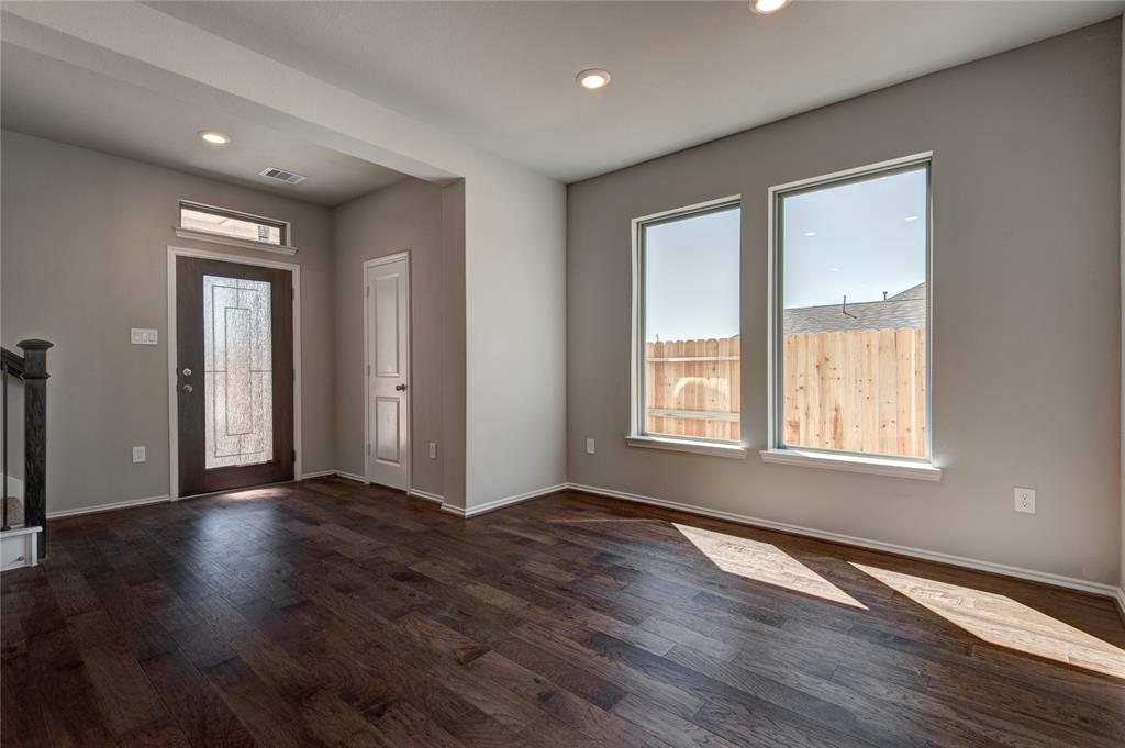 View from dining room of foyer and stairs to second floor.
