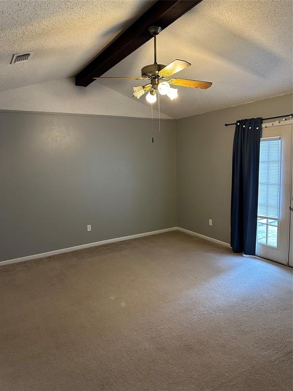 Ranch Style Ceilings make this room feel grand! With Double doors facing the patio.