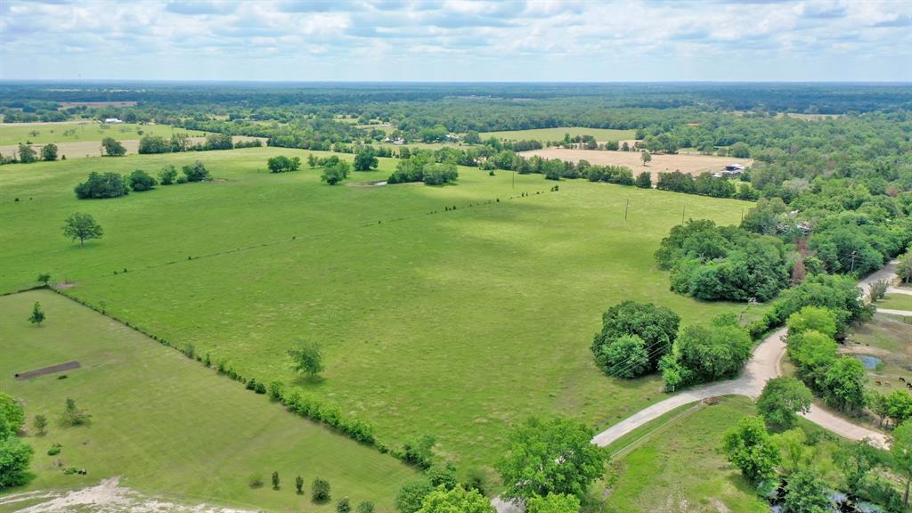 Whether you're looking for a place in the country to live or a getaway retreat to escape the crowds and constant noise of city life, don't miss this opportunity to own the perfect sized land tract in Western Madison County.  With two options of entry on a county-maintained road, this property presents approximately 98% open space with a slightly sloped elevation.  No restrictions or HOA here and there are several homesite options for your new site-built home or barndominium.  Electricity and community are located nearby - buyer to verify ability to have access to water.  Currently used as pastureland, there is an agricultural exemption in place; make this the ranchette you have long waited for.  Quick Access to Hwy 21, the location is just outside of Madisonville and approximately 30 minutes from Bryan/College Station allowing a convenient commute for those who work the city.