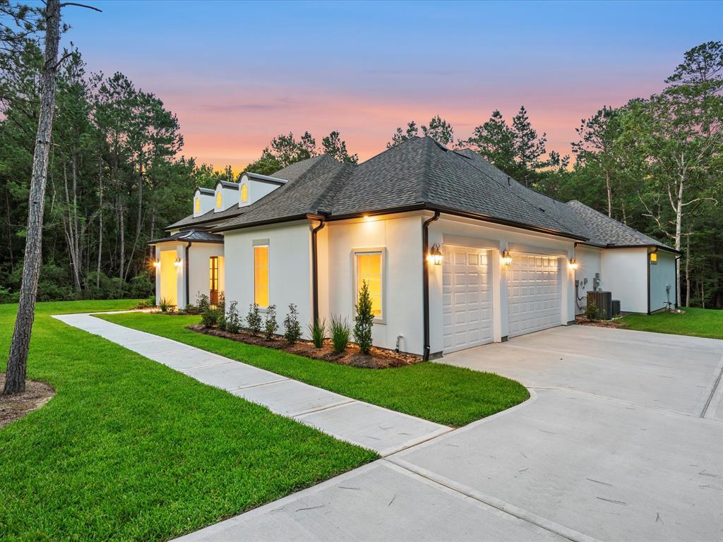 Large 3-car garage with space for added workshop or garage addition on the large 1.66 acre homesite