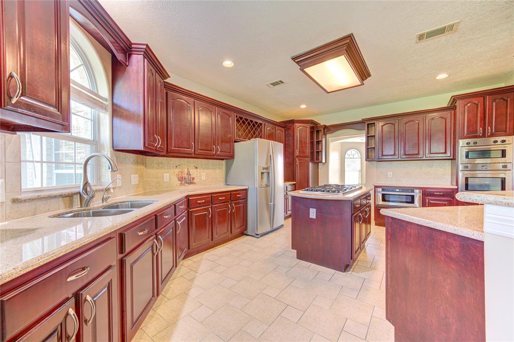 Six burner range, built in microwave, and double ovens are sure to make your family dinners and gatherings a breeze!