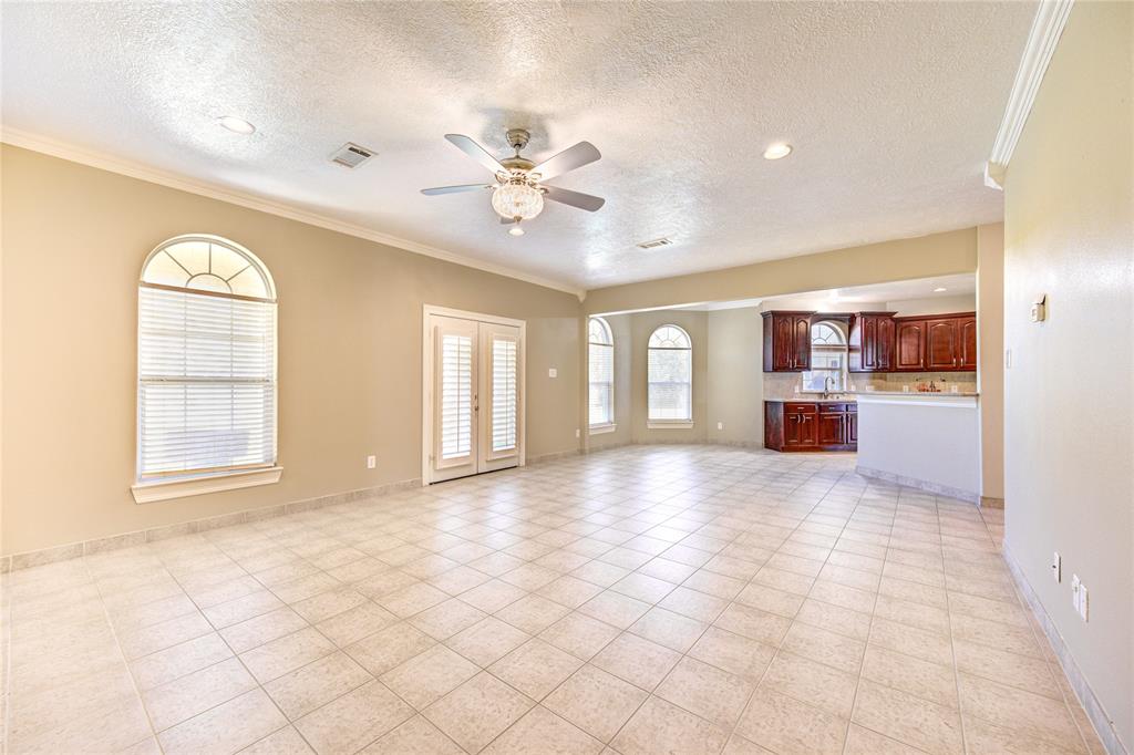 Family room is very spacious and has access to the backyard.