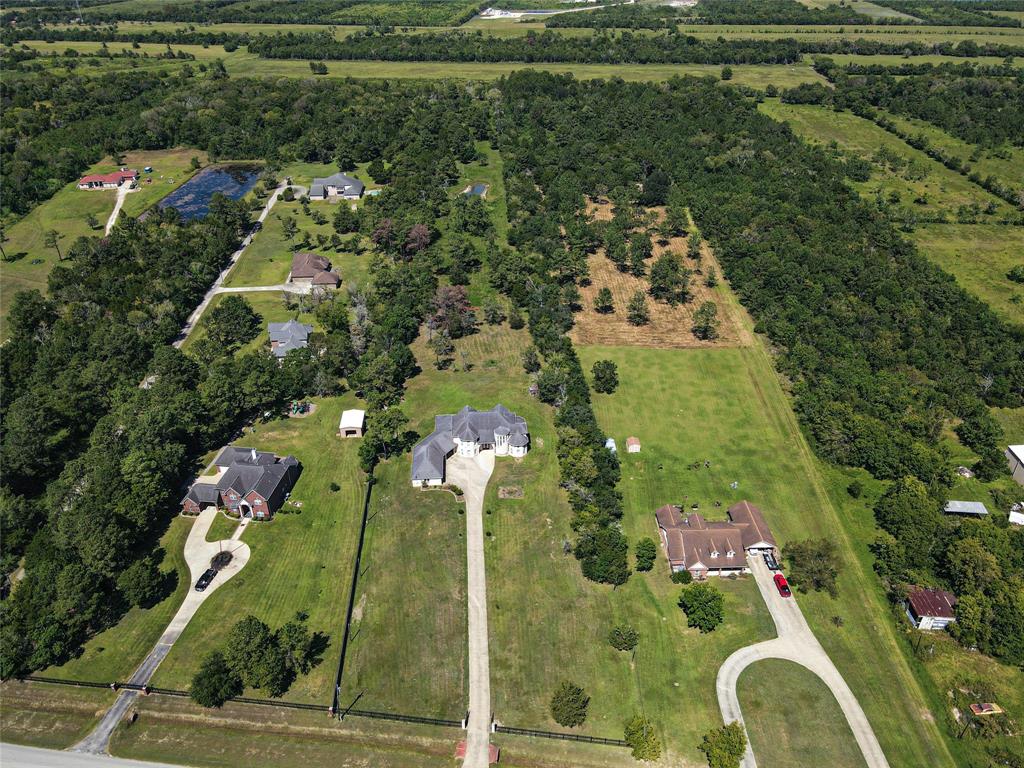 Aerial View. Property extends until end of tree line.