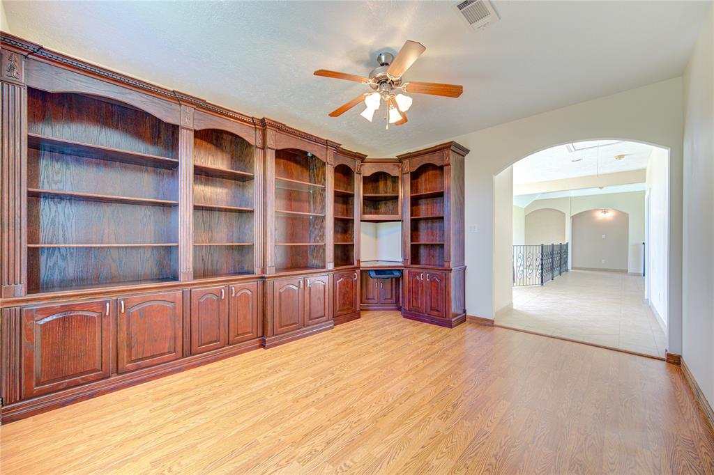 Second floor welcomes you with an impressive office area with tons of built-ins to display all of your belongings.