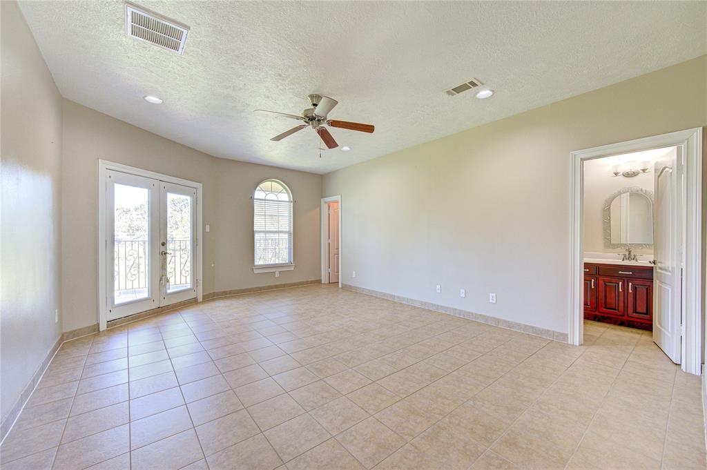 One of three secondary bedrooms located upstairs. All bedrooms have ensuite bathrooms and large walk-in closets as well.