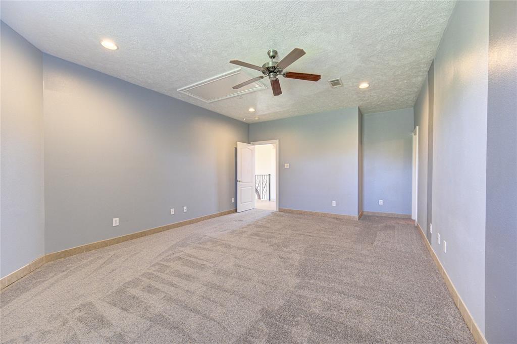 Larger secondary bedroom found upstairs as well.  Bedroom has access to one of the two upstairs balconies.