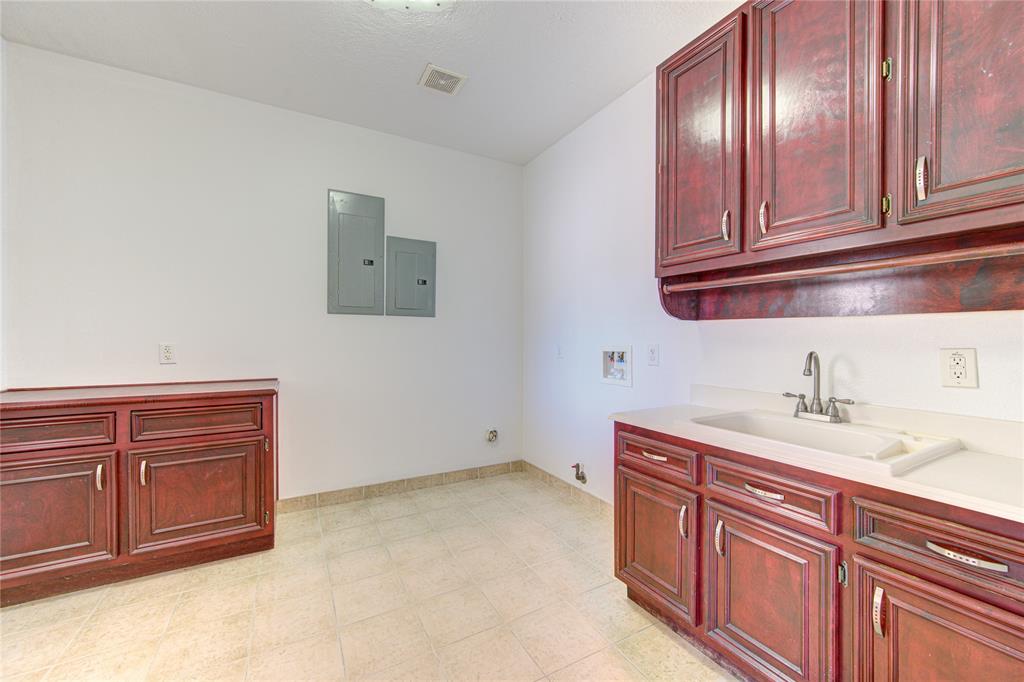 Large laundry area/mud area located near side door.