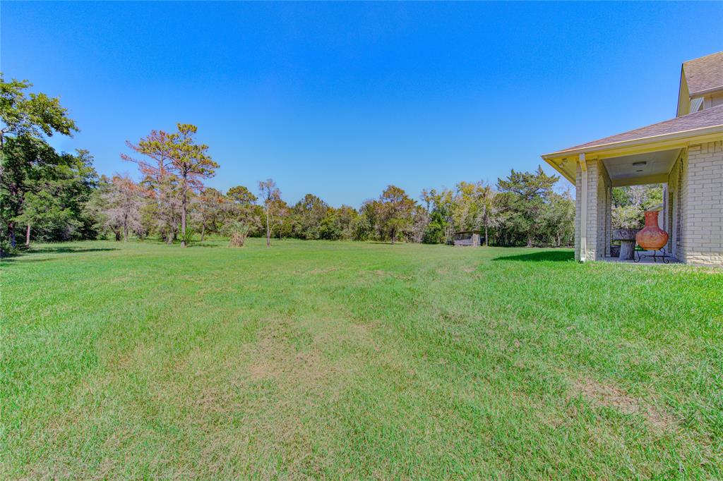 Look at that backyard!  Almost 8 acres of land, including pond, is yours to explore!