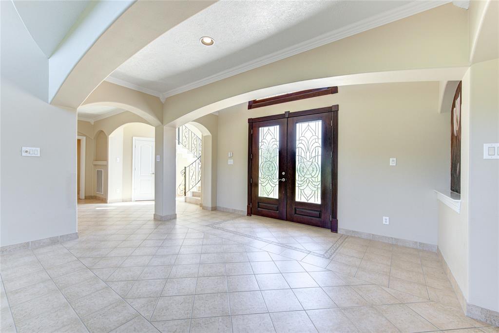 Upon entry, you are welcomed with soaring ceilings and an abundance of natural light.
