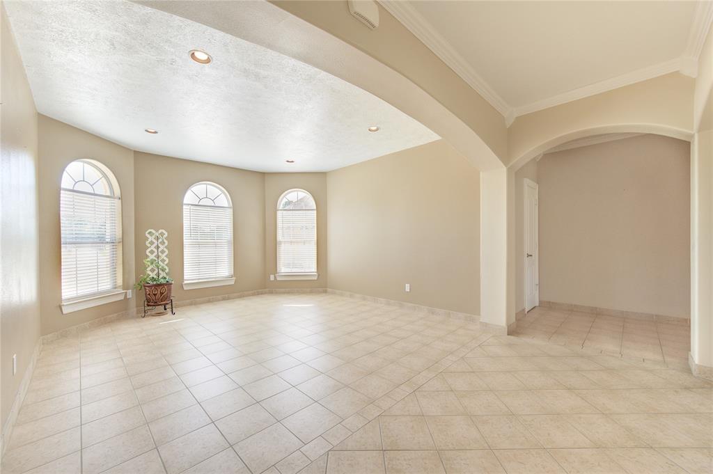 Formal dining room located just past entryway across from your gourmet kitchen.