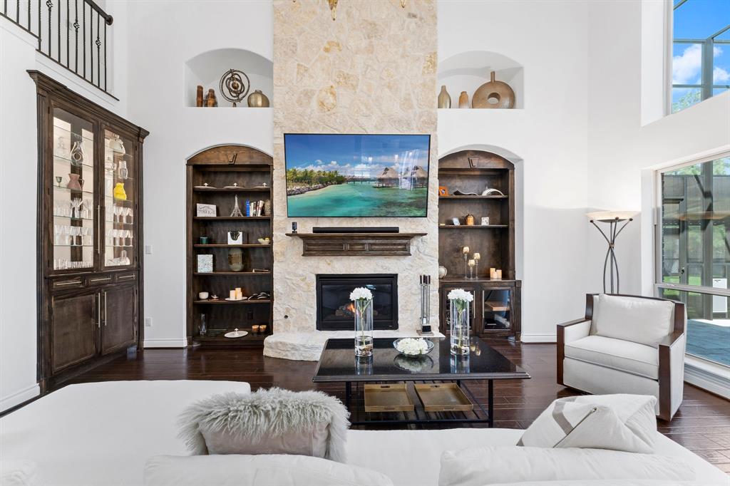 The view of the great room from the kitchen. The Seller added the China cabinet with LED lights on top and bottom and glass shelves to showcase your precious China, serving pieces, crystal and French cut crystal stemware.