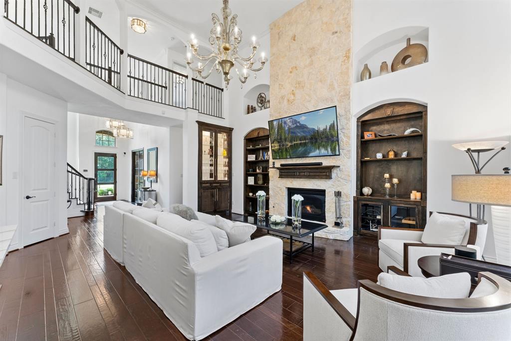 The view of the great room and entry way from the breakfast room. The Murano glass chandelier is an added conversation piece.