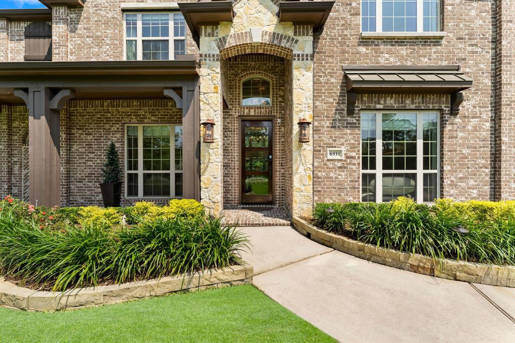 First impressions are important, and the new hardscape, professional landscaping, stone entrance, lighting and wood accents enhance the curb appeal of this home.