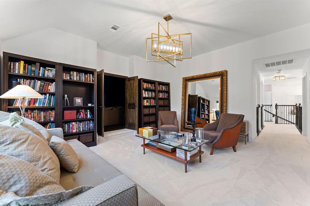 The game room has double doors leading to the media room.