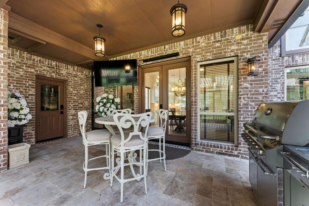 Just off the breakfast area, double French doors lead you to the outdoor living space where comfort meets luxury. There are 8 attached patio heaters that are also fans and misters. The weather will not dictate your use of this space. There are 2 gas hook ups if you desire a permanent outdoor kitchen in the future.